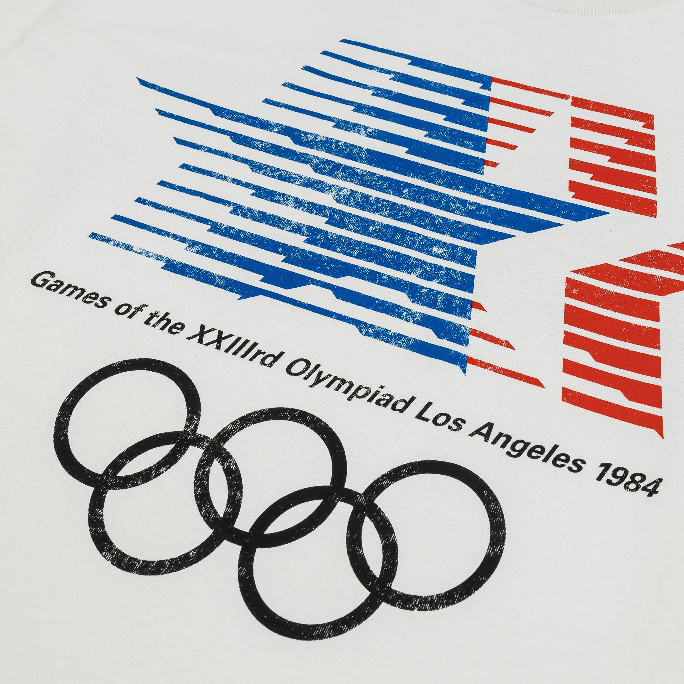 Perfect Fit 1984 Los Angeles Games Olympic Heritage Mens Short Sleeve Shirt (White/Blue)
